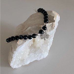 There are unique bracelet, made in Peru with charm in sterling silver 950.
